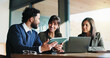 © BuyOutFelix04/peopleimages.com - Laptop, project management and tablet with business people in office for plan development. App, computer and meeting with corporate employee team in workplace boardroom for collaboration or research