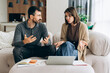 © Maria Vitkovska - Couple discussing financial problems at home