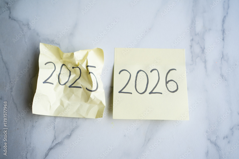 Crumpled 2025 sticky note showing passing year 2026 arriving Stock ...
