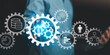 © chaylek - A businessman interacting with virtual gear icons representing automation, workflow, data management, and corporate efficiency in digital business technology and process improvement systems.