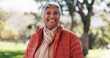 © Wess/peopleimages.com - Fashion, portrait and smile of old woman in park for break, retirement or winter wellness. Clothes, outfit and style with happy senior person outdoor in nature for cold morning or satisfaction