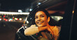 © Wess/peopleimages.com - Happy, woman and window of vehicle at night for travel, sightseeing city and tourism holiday. Smile, passenger and thinking in car for fresh air, adventure trip and nightlife view for evening journey