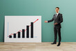 © Who is Danny - Businessman presenting growth chart concept during training seminar with upward trend on light green background for education and learning.