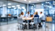 © dmmarychev - Blurred background of a business meeting in a modern glass conference room