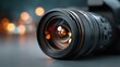 © Oulaphone - A close-up of a camera lens with a blurred background, showcasing rich bokeh effects and intricate detailing.