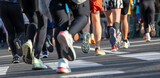 Close up of diverse runners feet during marathon running event in Ljubljana urban setting