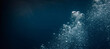 © Margarita Ratatosk - Underwater bubbles rising through deep blue water with sun rays. Concept of gas leaking from submerged pipeline, environmental pollution.