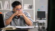 © amenic181 - Businessman looking stressed from work, Businessman working at office feels overworked and burnout