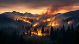 Widespread wildfire consuming a coniferous forest in a mountainous landscape under a smokey orange sunset sky