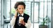 © Nina25/peopleimages.com - Phone call, coffee and child in office for business with cosplay for future career with contact. Happy, cappuccino and boy kid on mobile discussion for communication with corporate job in workplace.