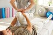 © Studio Romantic - Rehabilitation knee, leg massage, corrective exercise reducing pain, sport injury, joint health, fix muscle imbalance. Nurse, manual therapy doctor helping patient training, restoring good condition