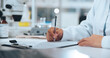 © SiphosethuFan/peopleimages.com - Hands, science and writing with person in laboratory for medical development or research results. Clipboard, notes and paperwork with scientist at work on clinic trial, experiment or investigation