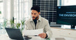 © FrameOn/peopleimages.com - Businessman, reading and document with laptop in office for research, energy saving stats and results. Person, pc and paperwork on photovoltaic grid revenue, company performance and solar panel sales