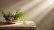 © Mariia Mazaeva - Rustic ceramic bowl with fresh vegetables and herbs on wooden table in soft morning sunlight with warm minimal interior