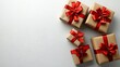 © Bruce - Minimalist festive gift arrangement with craft paper boxes and red ribbons on white surface, top half open space ideal for branding, marketing or seasonal presentation, soft daylight ambiance