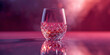© skillrise - Crystal Glass of Amber Liquid with Pink and Purple Light