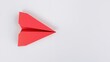 © The 2R Artificiality - Red origami paper airplane on a white background, suitable for UI backdrop