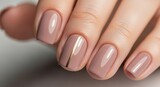 Elegant nude manicure with gold stripe on square nails