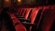 © Sylvia - Empty theater with rows of red velvet chairs under dramatic stage lighting atmosphere.
