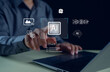 © paripat - Artificial intelligence technology concept showing a person using a laptop and touching a virtual AI interface with holographic icons representing innovation, automation, digital data transformation.