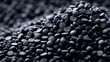 © Pixelzone - Stunning photo of close up of black rubber pellets a type of polymer resin.