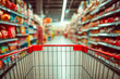 © SvoP - View from an empty shopping cart in a grocery store aisle with blurred shelves filled with products
