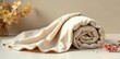 © DeeDay - Cream-colored textile rolled and draped elegantly, showcasing its soft texture and subtle sheen, complemented by delicate floral accents on a minimalist background.