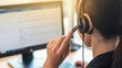© GOPAL MONDAL - Customer Support Representative at Work: A customer service professional, engrossed in their duties, manages communication through a headset, meticulously assisting clients.