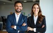 © Sharon - Happy executive managers, two business man and woman leaders entrepreneurs, corporate partners business owners professional work team standing arms crossed in office looking at camera. Portrait.