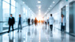 © CStock - Blurred image of professionals walking in a modern office corridor, symbolizing teamwork and productivity.