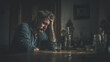 © Naufal - Depressed man sitting alone at a table with a bottle of alcohol, expressing sadness, loneliness, and mental health struggle, concept of addiction, stress, and emotional pain.