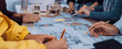 © InfiniteFlow - A dynamic collaborative design session where architects and clients engage in sketching blueprints and models for innovative building projects, showcasing teamwork. SACTR