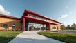 © Pete - Modern Canadian elementary school building with red accents and glass facade. Exterior view showcases contemporary architecture design. Sunny day at school campus with green grass and pathway