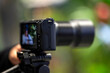 © hasan - Doha, Qatar - November 05, 2025:  Nikon ZR series mirrorless camera mounted on a tripod and recording a video in an outdoor setting.