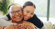 © SiphosethuFan/peopleimages.com - Portrait, senior care or caregiver with hug for woman on couch, support or community in nursing home. Retirement, elderly person or nurse embrace for comfort, happiness or wellness in assisted living