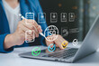 © Apichat - Document approve interface showing ISO compliance review by business professional using digital pen and laptop for audit and quality management system.