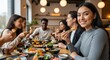 © Nazlykhan - Diverse group of friends enjoying sushi at a restaurant