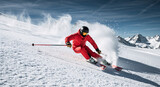 Skier in a red suit skiing fast down a snowy mountain slope. Dynamic action shot of an athlete carving in fresh powder. Winter sports and alpine adventure concept