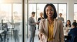 © Anna - African American businesswoman extending her hand for a handshake in an office. Professional woman welcoming a new partner. Business agreement and recruitment concept