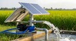 © Art & Stock - Solar powered water pump irrigating green field