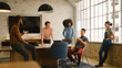 © Monkey Business - Young Multi Cultural Business Team Meeting Around Desk In Modern Office