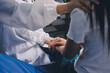 © ARMMY PICCA - Doctor giving hope. Close up shot of young female physician leaning forward to smiling elderly lady patient holding her hand in palms. Woman caretaker in white coat supporting encouraging old person
