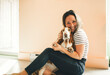 © Louis-Paul Photo - woman and her Basset dog at home having great time