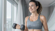 © Bonsales - Happy woman exercising with weights, building strength and vitality. Focusing on a healthy and active lifestyle indoors