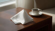 © Tinatin - clean white napkin elegantly placed at corner of frame essence of simplicity
