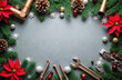 © miss irine - Plumbing tools and Christmas decorations frame grey background. Wrench pipe fittings pine branches poinsettias and baubles create holiday construction scene for your copy space.