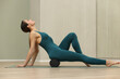 © zhagunov_a - Woman Using Foam Roller for Muscle Recovery Exercise
