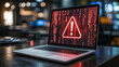 © Muhammad - Laptop screen showing a red exclamation mark with binary code warning for a cyber attack and security threat