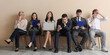 © Pixel-Shot - Applicants waiting for job interview near beige wall