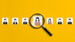 © Navee - Magnifying glass highlighting selected candidate among business profile icons for recruitment